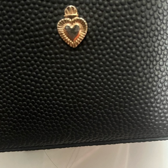 W Capsule Backpack with adjustable straps. Heart print on black material. - Picture 7 of 16